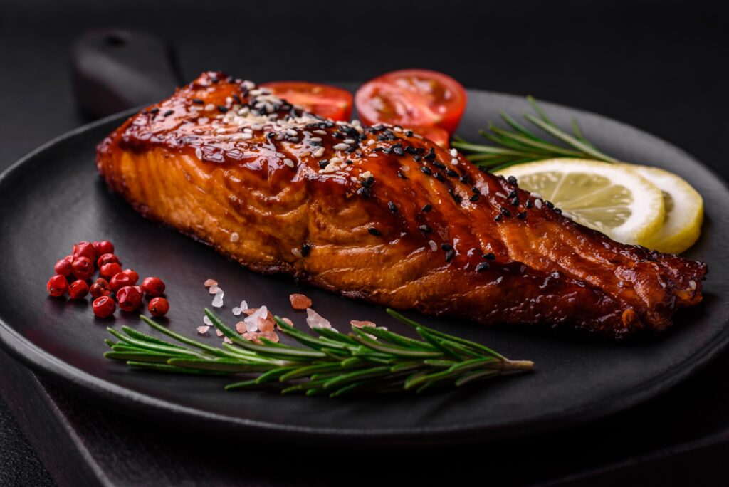 Grilled red salmon on plate with garnish
